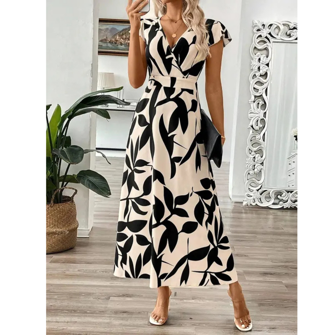 Korevyn - Elegante vloeiende maxi jurk voor dames met zwart en beige bloemenprint