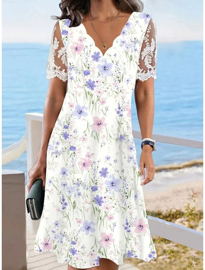 Daniella | Midi-jurk met bloemenprint en kanten mouwen