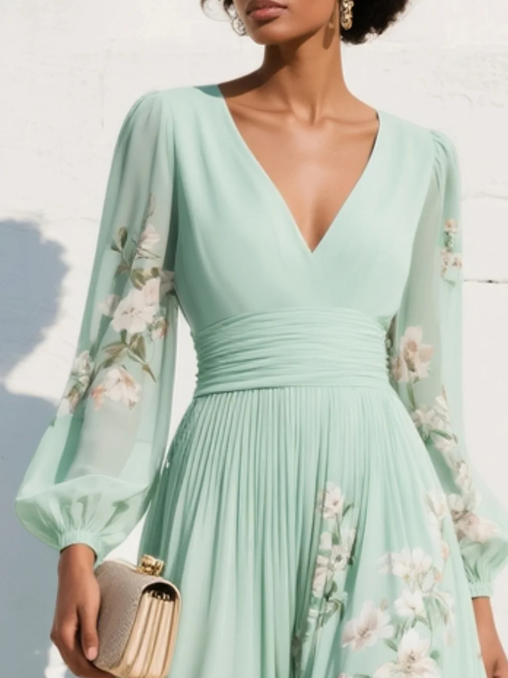 Arianna | Lichtgroene midi-jurk met v-hals en geplooide bloemenprint